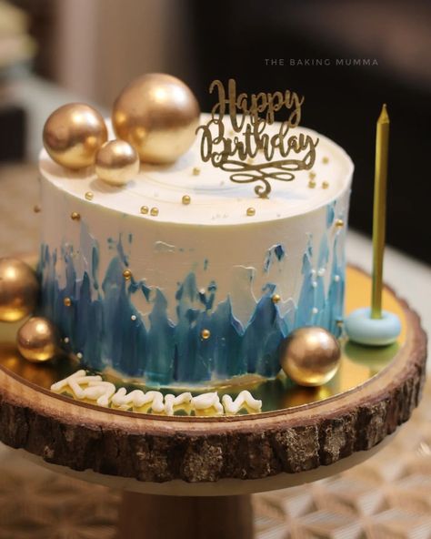 Bringing a touch of gold and elegance to birthday celebrations with this hand-painted blue and white abstract cake, adorned with golden spheres ✨🎂. Every detail, from the textured frosting to the personalized name, is made with love and care. 💙 #homebaker #cakeart #birthdaycakes #customcakes #goldcake #blueandgold #handpaintedcake #bakersofinstagram #cakesofinstagram #thebakingmumma Abstract Cake, Golden Birthday Cakes, Gold Birthday Cake, Hand Painted Cakes, Blue Cakes, Golden Birthday, Gold Cake, Cakes For Men, Gold Birthday