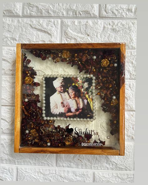 Wedding garland preserved ❤️🧿 Resin photo frame in a teak wood frame ♾️ Size 10inch Resin photo frame, resin garland preserved, handcrafted resin art, resin art, Bangalore resin art, resin artists Wooden Frame Resin Art, Resin Photo Frame, Resin Photo, Resin And Wood Diy, Anniversary Frame, Wedding Garland, Ganesh Art, Hanging Frames, Art Resin