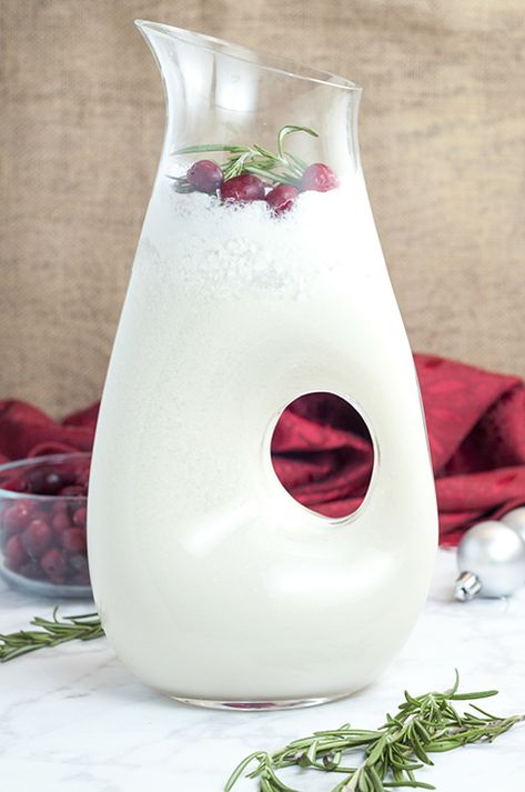 White Christmas Coconut Margarita Punch | Wishes and Dishes Christmas Coconut Margarita, Margarita Punch Recipe, Pitcher Margarita Recipe, Coconut Rum Punches, Christmas Coconut, Lime Margarita Recipe, Margarita Punch, Wishes And Dishes, Recipe For A Crowd