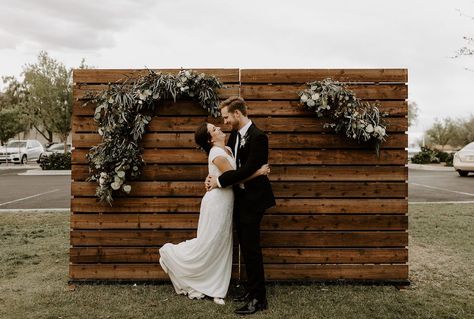 Our Wood Pallet Walls are one of our most popular inventory items! These versatile backdrops can fit any need. We have eight of these pallet wall backdrop rentals so rent as many as you need to create the necessary size of backdrop. Feel free to use nails, staples, or small screws to hang picture frames, greenery, floral arrangements, signage, and more. | Wood N Crate Rentals #arizonawedding #modernwedding #mesawedding #weddingrentals #palletwall Wood Backdrop Wedding, Wedding Photo Booth Rental, Pallet Backdrop, Wooden Backdrop, Simple Beach Wedding, Wooden Backdrops, Wood Backdrop, San Antonio Weddings, Weddings By Color