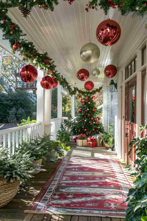 40 Christmas Front Porch Decor Ideas for a Festive Welcome Country Porch Christmas Decor, Decorate Front Of House For Christmas, Porch Christmas Ornaments, Red Outdoor Christmas Decor, Red Brick House Christmas Decor Outside, Country Christmas Front Porch Decor, Large Front Porch Christmas Decor, How To Decorate Your Front Porch For Christmas, Christmas Porch Decorations Front Entry