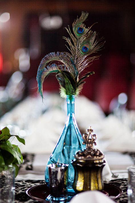 beautiful peacock centerpiece with Victorian bottles Blue Vase Centerpieces, Bohemian Style Inspiration, Peacock Centerpieces, Peacock Party, Peacock Theme, Peacock Decor, Rock N Roll Bride, Feather Wedding, Peacock Wedding