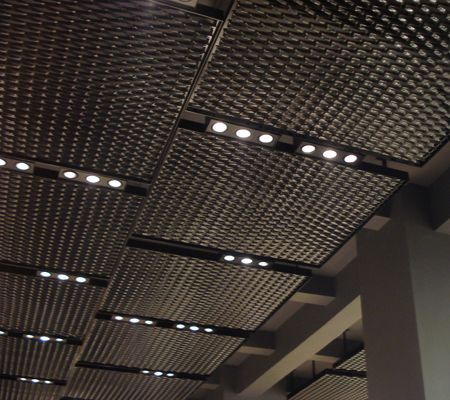 Mesh ceiling with integrated triple gimble lighting Blitz Design, Ceiling Design Ideas, Industrial Ceiling, Expanded Metal, Ceiling Treatments, Ceiling Light Design, Showroom Design, Metal Ceiling, False Ceiling Design