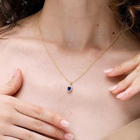 Add timeless elegance to her jewelry collection with this stunning Blue Sapphire Oval Pendant by Angara. 💙 Set in 14K solid gold, this classic piece is a perfect gift for September birthdays, anniversaries, or engagements. Shop now to make her day extra special Oval Pendant Necklace, Halo Pendant, Anniversary Jewelry, Birthstone Gifts, September Birthstone, Natural Blue Sapphire, Oval Pendant, Engagement Anniversary, Diamond Halo