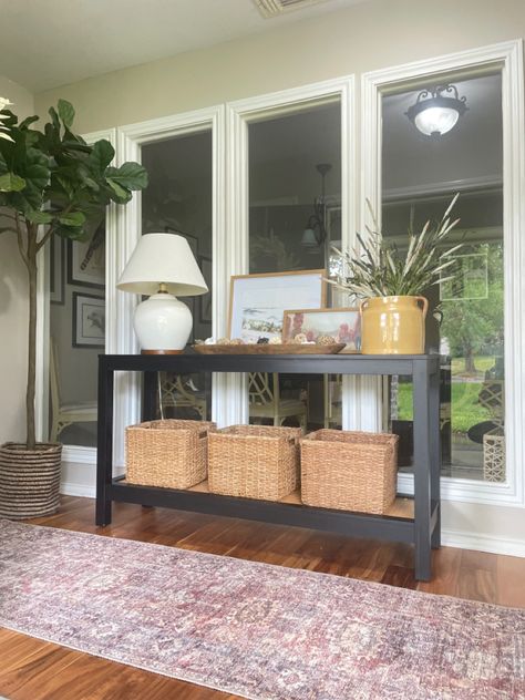 Table in front of windows, black console table, console table decor, console table styling, runner, entryway, entrway ideas Console Table In Front Of Window Decor, Console Table By Window, Table In Front Of Window Living Room, Console Table In Front Of Window, White Console Table Decor, Living Room Console Table Decor, Table In Front Of Window, Brass Lighting Fixtures, Mcm Credenza