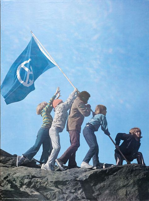 Poster has a photograph of five children raising a blue and white flag with a peace symbol overall. One child at right is crouched at the base of the flagpole while the other four are in a line on the other side of the pole helping to raise it up. The background is dominated by blue sky. Mother Earth Father Sky, Blue And White Flag, Peace Flag, White Flag, A Flag, Cultural Identity, Mother Earth, The Other Side, Bay Area