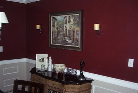 An example of Behr Velvety Merlot done in a dining area, pictures of the paint color on walls shows much more red hues than the paint swatch Burgundy Walls Living Room Ideas, Behr Maroon Paint Colors, Deep Red Wall Color, Burgundy Hallway Ideas, Maroon Painted Walls, Maroon Wall Color, Merlot Paint Color, Maroon Wall Paint, Maroon Walls Living Room