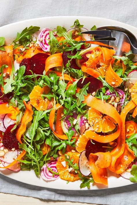 Leah Koenig's Shaved Beet and Carrot Salad with Citrus Scallion Dressing juxtaposes juicy clementines against crisp ribbons of carrot and crunchy root vegetables. Carrot Salad Dressing, Beet And Carrot Salad, Beetroot And Carrot Salad, Great Salad Recipes, Salad Recipe Ideas, Fruit Salad Recipe, Salad With Sweet Potato, Best Salad Recipes, Carrot Salad