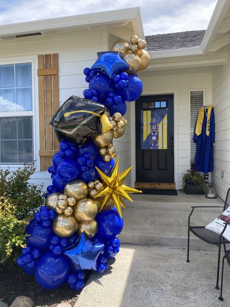 Balloon Garland Blue And Gold, Graduation Party Ideas Decorations Blue And Gold, Royal Blue And Gold Balloon Garland, Front Door Balloon Decor, Front Door Balloon Arch, Grad Balloon Garland, High School Graduation Balloon Garland, Graduation Balloon Garland Ideas, Balloon Garland Front Door