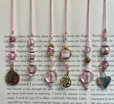 Mark your pages in style with these beautiful, handmade bookmarks. Created with an assortment of glass, acrylic, pearl, and metal beads. Perfectly sized for paperback books. These string style bookmarks measure approximately 11.5 to 12 inches in total length with approximately 8 inches between the beaded areas to fit most paperback book sizes. String Bookmarks, Beaded Bookmarks Handmade, Pink Bookmark, Pen Pal Kit, Pen Projects, Shot Book, Crafty Fox, Handmade Bookmarks, Creative Christmas Gifts