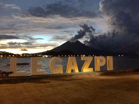 Dusk at our very own city... our home... View of Mayon Volcano at Legazpi City Boulevard.... Mount Mayon, Mayon Volcano, Legazpi City, Graffiti Wallpaper Iphone, Home View, Graffiti Wallpaper, Volcano, Our Home, Wallpaper Iphone