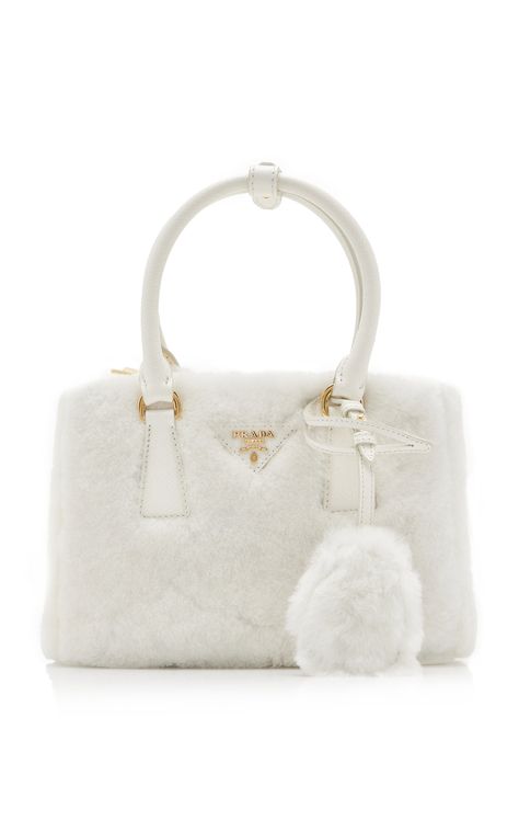 Find PRADA Galleria Shearling Bag on Editorialist. The Prada Galleria bag is crafted from shearling and features a scuff-resistant saffiano leather strap and handles. The bag has multiple compartments to secure all your belongings. It is a micro bag. Shearling Bag, Prada Galleria Bag, Adidas X Wales Bonner, Prada Galleria, Luxury Bags Collection, Aesthetic Bags, Micro Bag, Wales Bonner, Girly Bags