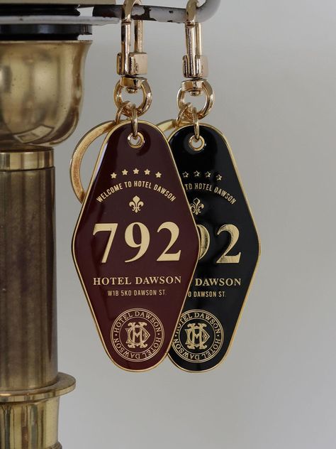 Editor's Note‘Hotel Dawson’, which is inspired by the sensibility of an old-fashioned and historic hotel in a European city, has designed an in-depth scent taking individual tastes into consideration.- Rounded diamond shape keyring- 792 hours of maturation that makes the Hotel Dawson diffuser soft and rich in scent- Great to match with any items- Daily point itemMeasurements(in.)- Size: 1.38 in. * 2.71 in. Composition & Care- Metal- Avoid direct heat and moisture- Wipe off moisture and stains with a dry cloth- Avoid friction to prevent the peel-off from the metal platingDesigner- by HOTEL DAWSON Hotel Keys Design, Hotel Check In, House Keys Aesthetic, Gift Shop Design, Check In Hotel, Hotel Items, Hotel Merch, Keys Aesthetic, Hotel Keys