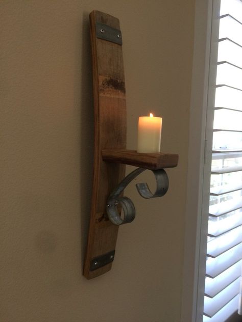 Wine Barrel Stave Wall Candle Holder Add decor to any room with our Barrel Stave Wall Mounted Candle Holder. The sconce is made from the stave of a Napa Valley retired wine barrel. We carefully cut and curl the metal bands to add decoration to to this beautiful wall piece. Simply insert a candle of your choice and enjo Farmhouse Candle Decor, Wood Wall Candle Holders, Whisky Barrel Ideas, Barrel Stave Wall, Barrel Stave Projects, Wooden Candle Sconces, Barrel Stave Ideas, Stave Projects, Wine Barrel Art