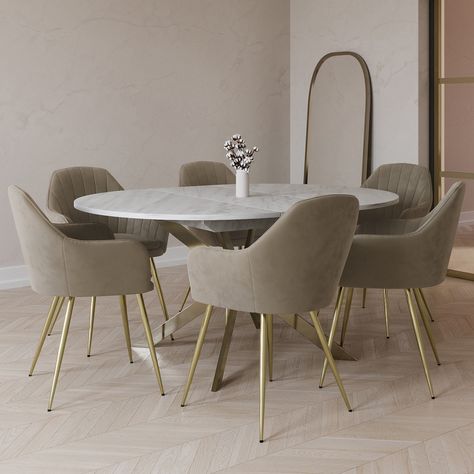 . This bundle includes  . 1 x Round to Oval Marble Effect Extendable Dining Table in White – Reine  . 6 x Mink Matt Velvet Dining Chairs – Logan . All about meTransform your dining space with this modern dining set perfect for hosting. The table easily extends with the simple butterfly mechanism and the textured marble effect top is scratch-proof heat-resistant and easy to wipe clean. The Logan dining chairs are finished in mink matt velvet with brushed brass legs the two-tone design Dining Table Marble Top Modern, Cream Marble Table Dining, White Marble Kitchen Table, Oval Dining Table Marble, Dining Table And Chairs Ideas, Marble Table Dining, Neo Classic Kitchen, Oval Extendable Dining Table, Chairs With Gold Legs