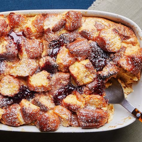 This recipe is a great way to use up stale doughnuts, but if you’ve got freshly made ones, that works too. Start with classic glazed or sugar-coated yeasted doughnuts, which have a light and airy texture, rather than cake doughnuts, which are dense and will turn to mush when combined with the custard. The bread pudding will puff heroically near the end of its baking time, like a soufflé, but fall shortly after it comes out of the oven; don’t worry, it’s supposed to do that! The final texture is Day Old Donut Recipes, Doughnut Bread Pudding Recipe, Doughnut Bread, Donut Bread Pudding, Donut Bread, Best Breakfast Casserole, French Toast Casserole Recipes, Toffee Sauce, Brunch Spread