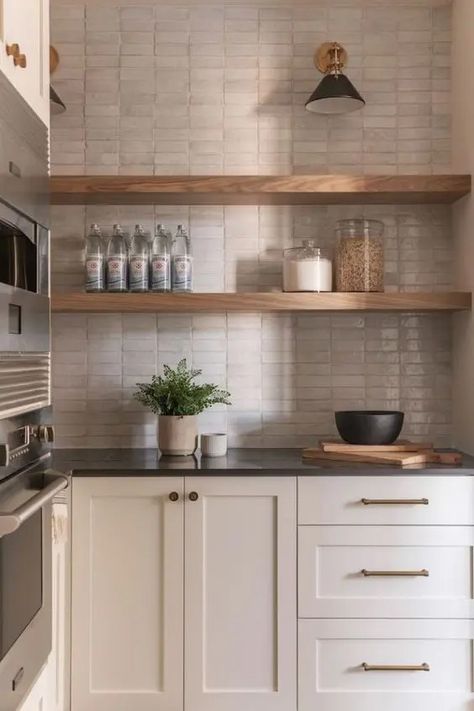 a neutral kitchen with shaker style cabinets, black countertops, a tan Zellige tile backsplash, open shelves and black countertops Backsplash Trends, Black Countertops, Becki Owens, Neutral Kitchen, Kitchen Tile, Kitchen Tiles Backsplash, Tile Installation, White Tiles, Counter Tops