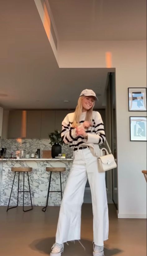 Striped White Sweater Outfit, White Pants With Sweater, White Pants And Sweater Outfit, White Cord Pants Outfit, White Flare Pants Outfit Casual, White Stripped Sweater Outfit, Cream Flares Outfit, Cream Baseball Cap Outfit, Cream Cap Outfit