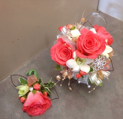 LIKING THE BIG ONE.  I AM REALLY LIKING THE CORAL ROSES FOR THE MOM CORSAGES WITH THE LITTLE POP OF WHITE - Coral and white wrist corsage Coral Corsage, White Wrist Corsage, Flowers At Wedding, Boutonniere Ideas, Bracelet Corsage, Homecoming Flowers, Prom Corsages, Prom Corsage And Boutonniere, Wrist Corsage Prom