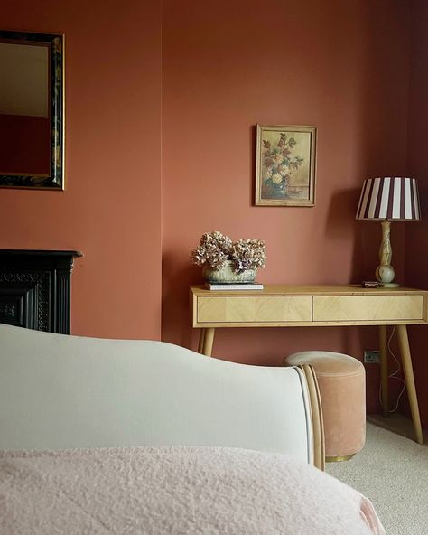 1 Cosy Bedroom Corner 🕯️ ✨- in 4 ways! Which is your favourite? Although this bedroom was only decorated just over a year ago this shows how much I like to shift furniture around! But really this post is to hail the impact of this beautiful warm terracotta paint colour on this previously greyish north facing room! Captured in different seasons and lights - this room still glows! Have you got a paint colour that never fails to evoke warmth and cosiness? I also think this is me slowly easing ... Coffee Coloured Bedroom, Bedroom North Facing, Tiny Bedroom Paint Ideas, Terracotta Feature Wall, Colour Drenched Bedroom, Colour Drenching Bedroom, Color Drenching Bedroom, Orange Bedroom Walls, North Facing Room