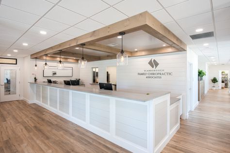 Scarborough Family Chiropractic hosts grand opening | Gawron Turgeon Architects Chiropractor Office Design, Orthodontic Office Design, Chiropractic Office Design, Front Desk Design, Doctor Office Design, Orthodontic Office, Dentist Office Design, Waiting Room Design, Optometry Office