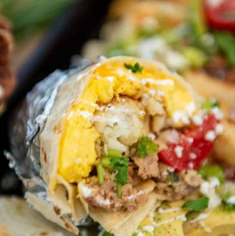 Camping Breakfast Burritos (Make-Ahead) - Girl Carnivore Camping Breakfast Burritos, Carnivore Breakfast, Homemade Burritos, Make Ahead Breakfast Burritos, Girl Breakfast, Egg Sausage, Potato Tots, Camping Breakfast, Freezer Meal Planning