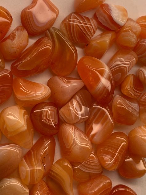 This listing is for one of small carnelian tumbles. The average 2.5-5 grams in weight. Carnelian is red agate. These carnelian are a rich warm orange, with banding. They are tumbled and polished nicely. One with banding will be hand selected for you. Most of these look like plain carnelian on one side, and banded on the other. Origin: Brazil Mohs Hardness Scale: 7 Some of us are just beginning our relationship with rocks and crystals. Choosing a rock or crystal is Intuitive... be Intuitive...and Banded Carnelian, Hardness Scale, Crystal Aesthetic, Color Vibe, Carnelian Crystal, Orange Agate, Orange Crystals, Pretty Rocks, Orange Aesthetic