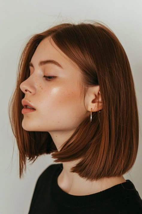 For those seeking to make a striking hair statement, consider the sleek and elegant blunt cut bob. This classic hairstyle has remained a top choice for those with a keen sense of style. Opting for this look can instantly elevate your overall appearance, giving you a modern and sophisticated edge. Embrace the boldness of the blunt cut bob and revel in its timeless allure that never goes out of fashion. Brunette To Orange Hair, Bob Haircut No Layers, Neck Length Hair Straight, Low Maintenance Mid Length Haircut, Ginger Hair Long Bob, Without Bleach Hair Color, From Brunette To Copper, Fun Brown Hair, Dark Cooper Short Hair