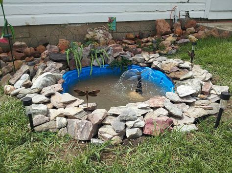 Home made pond for our little back yard. All you need is a kiddy pool and some pretty rocks. Kiddie Pool Turtle Pond, Pond Out Of Kiddie Pool, Kiddie Pool Pond Ideas, Diy Pond From Kiddie Pool, Diy Kiddie Pool Pond, Kiddie Pool Fountain, Kiddie Pool Fish Pond, Turtle Ponds Backyard Diy Cheap, Backyard Kiddie Pool Ideas