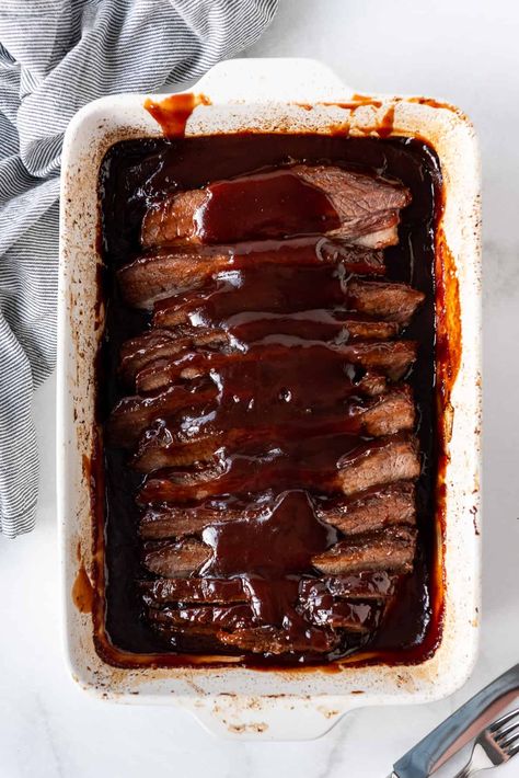 This slow roasted BBQ Beef Brisket recipe is made in the oven or slow cooker for the most tender and juicy meat ever, with a sweet & smoky barbecue sauce! I'm sharing all my best tips for how to cook brisket for a crowd, since this is a great choice for large dinner parties. It's so good, no one will care the meat wasn't smoked for hours! #brisket #beefbrisket #oven #slowcooker #crockpot #bbq #barbecue #best #easy #Christmas #dinner Bbq Beef Brisket, Beef Brisket Recipe, How To Cook Brisket, Brisket Recipe, Beef Brisket Recipes, Brisket Recipes, Bbq Beef, Easy Oven, Beef Brisket