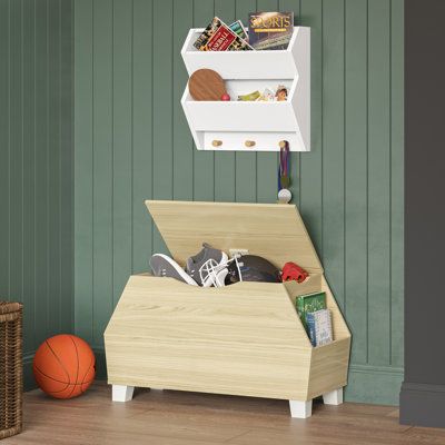 Keep toys and other kid’s clutter concealed in this contemporary toy box. With a clean, painted finish and four solid pine wood legs, this two-tone toy box is versatile enough to add stylish organization to any room of the home. Features two book slots on the sides, perfect for storing and displaying your little ones’ favorite story books, coloring books and more. Toss toys, games and stuffed animals into the toy box and close the child-safe lid for a tidy appearance. Finish: Light Woodgrain | R Toy Storage Bench, Cubby Storage Bench, Bookshelf Lighting, Toy Storage Organizer, Kids Toy Organization, Toy Organizer, Toy Storage Organization, Toy Storage Boxes, Kid Toy Storage