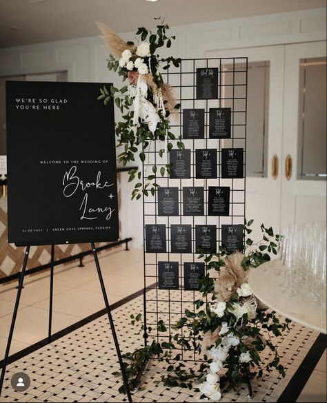 Wedding Center Piece Ideas For Round Tables, Assigned Seating Ideas, Black Grid Wedding Backdrop, Industrial Seating Chart Wedding, Industrial Seating Chart, Black Industrial Wedding Decor, Wedding Table Assignment Ideas Reception Seating, Wedding Photo Drop, Alternative Seating Chart Wedding