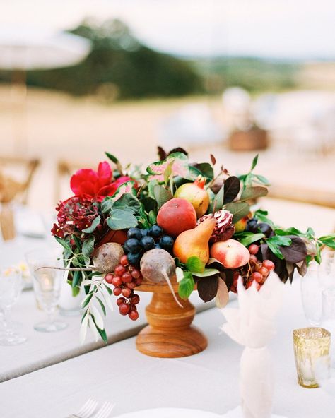 Fruit-filled wedding decor is taking the world by storm! And we have all the best examples here. Whether spilled romantically over a cake, bedecking a garland chandelier, gracing a tablescape or becoming the star of the bridal bouquet, this wedding trend is here to stay. Are you not wholly convinced by this all-fruit wedding centerpiece alone? #ruffledblog Fruit Centerpieces Wedding, Themed Wedding Decorations, Peonies Centerpiece, Fruit Centerpieces, Lush Wedding, Fruit Wedding, Wedding Themes Fall, Fall Wedding Centerpieces, Wedding Floral Centerpieces