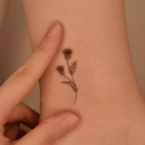 Thistle Wrist Tattoo, Thistle Outline Tattoo, Scottish Flowers Tattoo, Thistle Tattoo Meaning, Thistle Finger Tattoo, Simple Scottish Tattoo, Flower Of Scotland Tattoo, Small Thistle Tattoo Simple, Scottish Thistle Tattoos