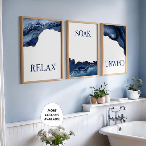 Transform your space with our Blue and Gold Bathroom Decor set! This charming trio of prints features elegant designs with uplifting messages: "Relax, Soak, Unwind." Perfect for adding a touch of serenity to your bathroom, these vibrant blue and gold pieces create a calming atmosphere. Elevate your oasis today! Unframed prints are available in the following sizes below: ----------------------------------------------------------------------------- 8x10in -  prints are shipped in a board-backed en Blue And Gold Bathroom Decor Ideas, Blue White And Gold Bathroom, Blue And Gold Bathroom Decor, Blue And White Bathroom Ideas, Navy Blue And Gold Bathroom, Blue Bathroom Decor Ideas, Blue Bathroom Art, Blue And Gold Bathroom, Blue Bathroom Walls