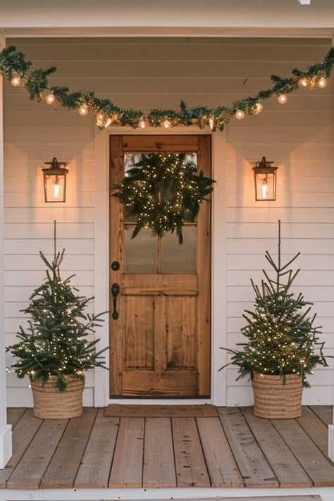 Spruce up your farmhouse Christmas porch with delightful decorations and rustic garlands. Explore 50+ modern decor ideas, including festive front signs for a cozy holiday vibe! Outdoor Porch Decor Christmas, Farmhouse Outside Christmas Decor, Christmas Outdoor Lights Farmhouse, Christmas Farmhouse Exterior, Christmas House Decor Exterior, Classic Christmas Front Porch, Christmas Boho Decor Ideas, Farmhouse Porch Christmas Lights, Christmas Farmhouse Front Porch