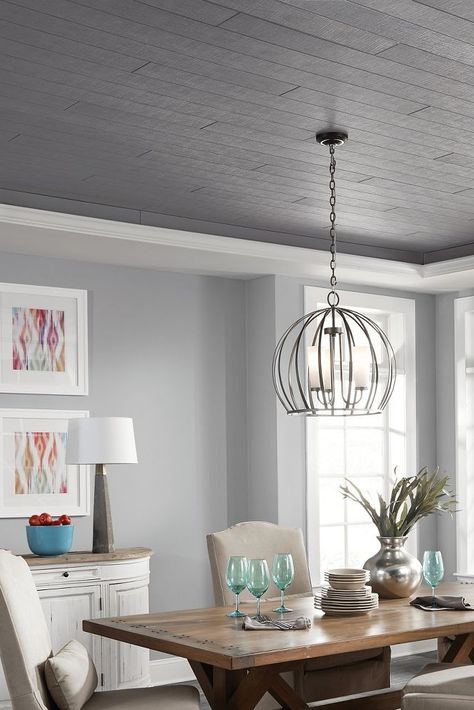 New ceilings colors and textures abound in this dining room featuring WOODHAVEN Woven in Charcoal Gray.  Installed in a tray ceiling, this shiplap/wood look ceiling is the focal point of this beautiful dining area. Want more ceiling ideas? Get them from your friends at Armstrong Ceilings! #armstrongceilings #ceilingideas #woodceilings #dining Tray Ceiling Ideas, Ceiling Ideas Living Room, Wood Plank Ceiling, Shiplap Wood, Dark Ceiling, Grey Ceiling, Shiplap Ceiling, Armstrong Ceiling, Plank Ceiling