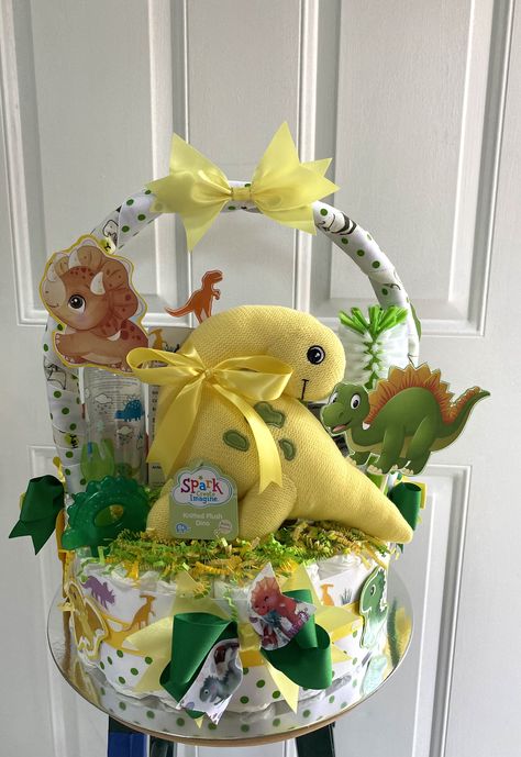 Dinosaur Diaper Cake Gift Basket Made By Norma’s Unique GiftBaskets Dinosaur Themed Gift Basket, Dinosaur Diaper Cake, Dino Diaper Cake, Dinosaur Baby Gift Basket, Diaper Basket Gift Simply Unique Baby Gifts, Cake Gift Basket, Baby Boy Gift Baskets, Baby Shower Gift Basket, Dinosaur Baby Shower