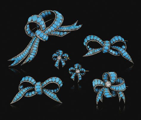 Collection of simulated turquoise, turquoise and diamond jewels, 1840s. Comprising: a large bow brooch set with oval cabochon simulated turquoise and turquoise between borders and accents of rose diamonds, together with five smaller bow brooches similarly set, three decorated to the centre with a circular-cut diamond, mounted in silver and gold, later alterations. Formerly in the Thurn und Taxis jewel collection Victorian Jewellery, Extraordinary Jewelry, Antique Turquoise, Victorian Ladies, Blue Inspiration, Ribbon Jewelry, Diamond Bows, Diamond Jewel, Bow Jewelry