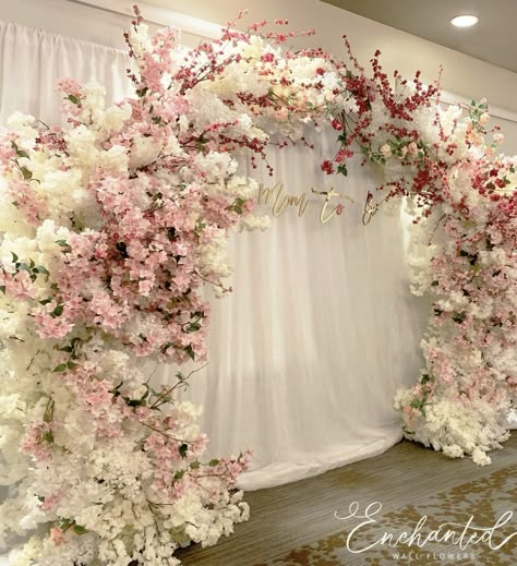 ￼ ￼  Pictures are for reference only. Theme is Japanese Cherry Blossoms. 🌸  Colors-shades of pink some burgundy    $165 Flowering  Mini balloon garland Pipe & Drapes or Grass Wall Decor  ￼ ￼ ￼ ￼    $250 Full size balloon garland (3 colors) 6ft or longer Ring Back drop 7ft Flowers  $30 for drapes behind stand.  Custom Sign - free Total $280   ￼ ￼  ￼ ￼ ￼ ￼   The last two pictures are lovely, the back drops are $350+.  ￼ ￼ ￼ Arch Home, Wedding Arch Rental, Cherry Blossom Wedding Theme, Flower Wall Rental, Cherry Blossom Theme, Wedding Background Decoration, Wedding Entrance Decor, Church Wedding Decorations, Cherry Blossom Wedding