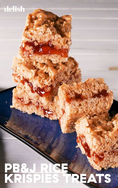 These PB&J Rice Krispie Treats Bring Us BackDelish Rice Krispy Sushi Rolls, Pbj Rice Krispy Treats, Peanut Butter Jelly Rice Krispie Treats, Pbj Rice Krispies, Pb&j Ideas, Pb&j Rice Krispie Treats, Peanut Butter And Jelly Rice Krispies, M&m Rice Crispy Treats, Pb Rice Krispie Treats