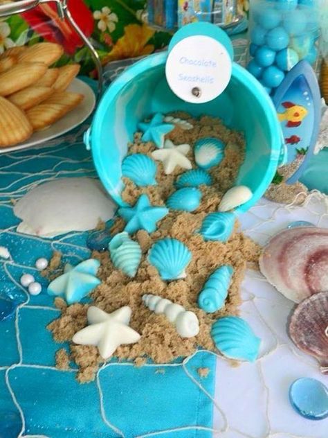 Chocolate Seashells over sand: You'll need a clean new bucket, some chocolates made using a seashell mold, and some brown sugar to look like sand. Seashell Birthday Party, Seashell Birthday, Party Candy, Mermaid Birthday, Mermaid, Birthday Party, Baby Shower, Candy, Shower