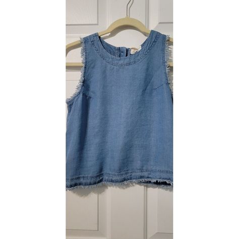 This Thread & Supply Cropped Tank Top Is A Must-Have Addition To Your Wardrobe. The Sleeveless Top Features A Square Neckline, Back Button Closure, And Fringe Hems. The Top Is Made Of 100% Tencel, A Soft And Breathable Fabric That Is Perfect For Any Occasion. The Chambray Pattern And Blue Color Add A Classic Touch To The Top. It Comes In Size Xs And Has A Regular Fit. The Tank Top Is Versatile And Can Be Paired With Any Bottom For A Chic Look. Dolman Sleeve Shirt, Cropped Button Up Shirt, Sleeveless Chambray, Button Crop Top, Linen Crop Top, Plaid Crop Top, Tiered Tops, Denim Crop Top, Off Shoulder Crop Top