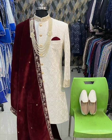 Ivory Sherwani with maroon match #sherwani #ivory #trending #photography #wedding #mesnwear Wedding Dresses For Men Indian Mens Fashion, Ivory Sherwani Grooms, Maroon Sherwani Groom, Groom Wedding Dress Sherwani, Bride And Groom Indian Wedding Outfit, Maroon Sherwani, Groom Indian Wedding Outfits, Sherwani Design, Ivory Sherwani