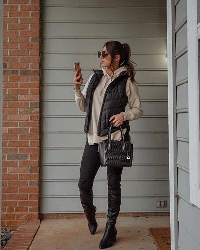 Perfect Sunday outfit for winter. 😍 can’t beat an oversized hoodie, black puffer vest, leggings, and over the knee boots. http://liketk.it/37fsp #liketkit @liketoknow.it Black Sherpa Vest Outfit, Black Puffy Vest Outfits For Women, Puffer Vest With Hoodie Outfit, Black Puffer Vest Outfits For Women, Black Puffy Vest Outfit, How To Style A Puffer Vest, Oversized Puffer Vest Outfit, Puffer Vest Outfit Black, Black Vest Outfits