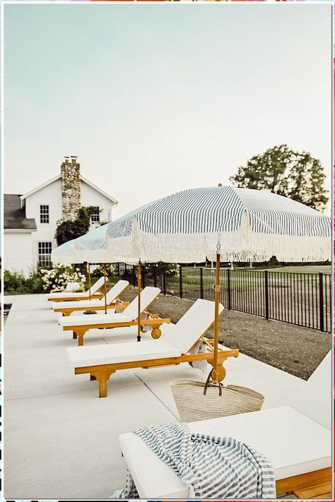 Patio umbrellas can be a great addition to your outdoor space. Not only do they add shade, but they also provide a place to relax and enjoy the outdoors. Outdoor Patio Ideas With Umbrella, Pergola By Pool Ideas, White Pool Umbrella, In Pool Umbrella, Pool Umbrella Ideas, Outdoor Umbrella Ideas, Outdoor Pool Area Ideas, Patio Umbrella Ideas, Pool Patio Decorating Ideas