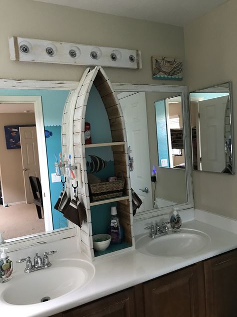 Canoe shelf in underwater themed bathroom. Lakehouse Bathroom Ideas Decor, Nautical Themed Bathroom, Nautical Theme Bathroom Ideas, Water Bathroom Theme, Lake Theme Bathroom, Lake Themed Bathroom, Fishing Themed Bathroom, River Themed Bathroom, Boat Themed Bathroom