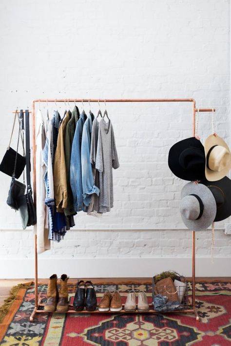 Short on closet space? Store your favorite clothes and accessories on this stylish DIY copper rack. Open Clothes Rack, Clothing Rack Diy, Clothes Rack Aesthetic, Clothes Rack Bedroom, Hat Rack Ideas, Copper Decoration, Wall Mounted Clothing Rack, Diy Hat Rack, Clothing Rack Bedroom