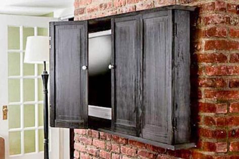 DIY TV Cabinet from thisoldhouse.com Tv Cover Up, Hide Your Tv, Hidden Tv Cabinet, Best Tv Wall Mount, Outdoor Tv Cabinet, Tv Enclosure, Hanging Tv On Wall, Outdoor Tv Covers, Wall Mounted Tv Cabinet