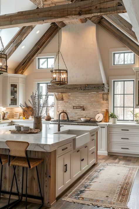 : Discover the latest trends in farmhouse kitchen design, from rustic reclaimed wood cabinets to sleek white shakers. #farmhousekitchen #kitchendesign Dream Kitchen Country, Farmhouse Big Kitchen, Modern Farm Kitchen Design, Kitchen With Pitched Ceiling, Kitchen Ideas Modern Farmhouse, Rustic White Kitchen, Modern Farm Kitchen, Luxury Farmhouse Kitchen, Open Kitchen Ideas